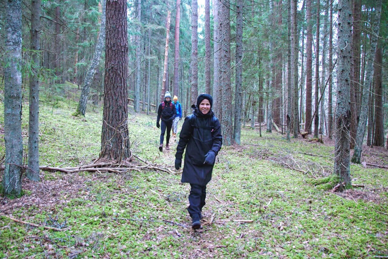 Mearra people hiking in a forest