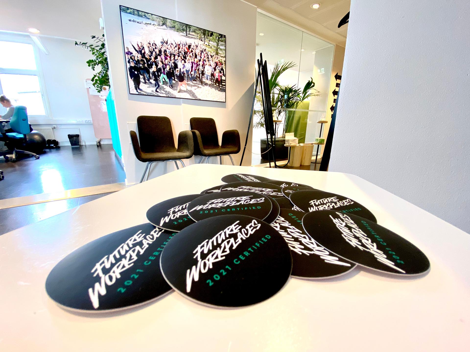 A collection of Future Workplaces 2021 Certified mouse pads on the table