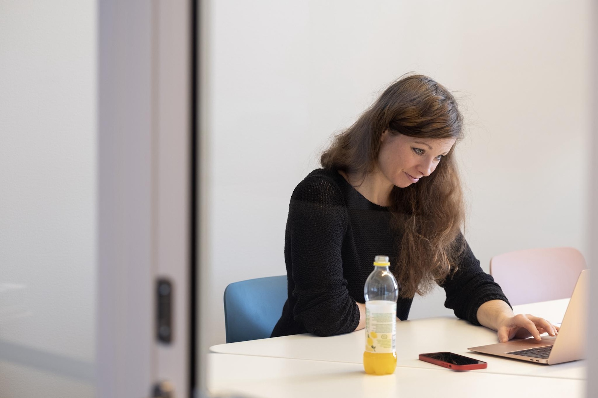 Woman sitting at the table and working.