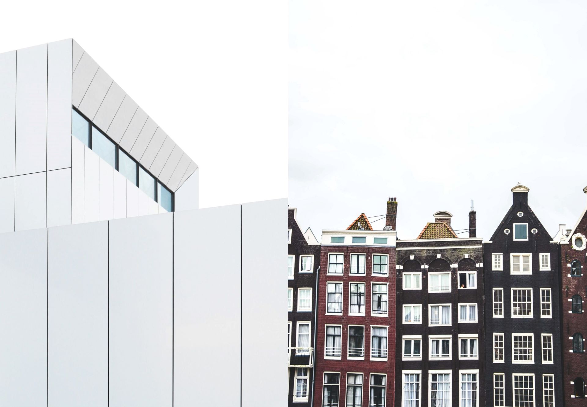A modern building and a row of old townhouses.