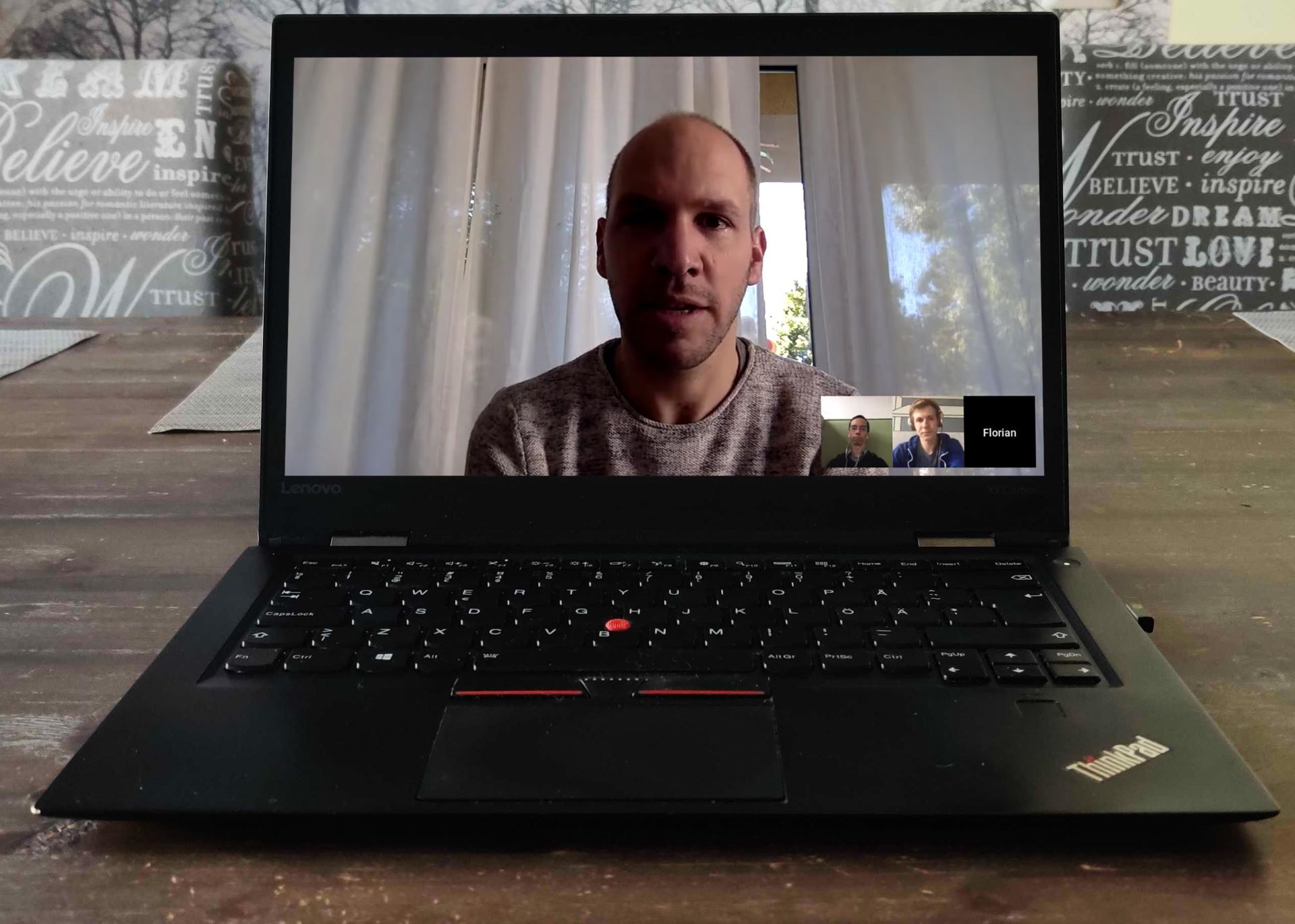 Person in a video meeting with poor light.