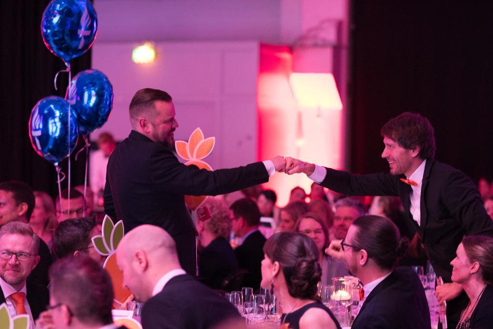Mikko Laine and Toni Sinisalo fistbumping at the gala