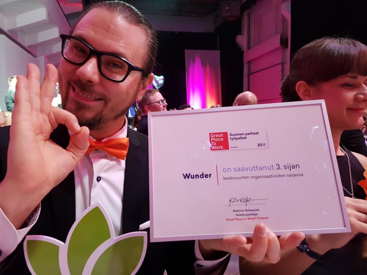 Timo Kirkkala holding Mearra's diploma for 3rd place