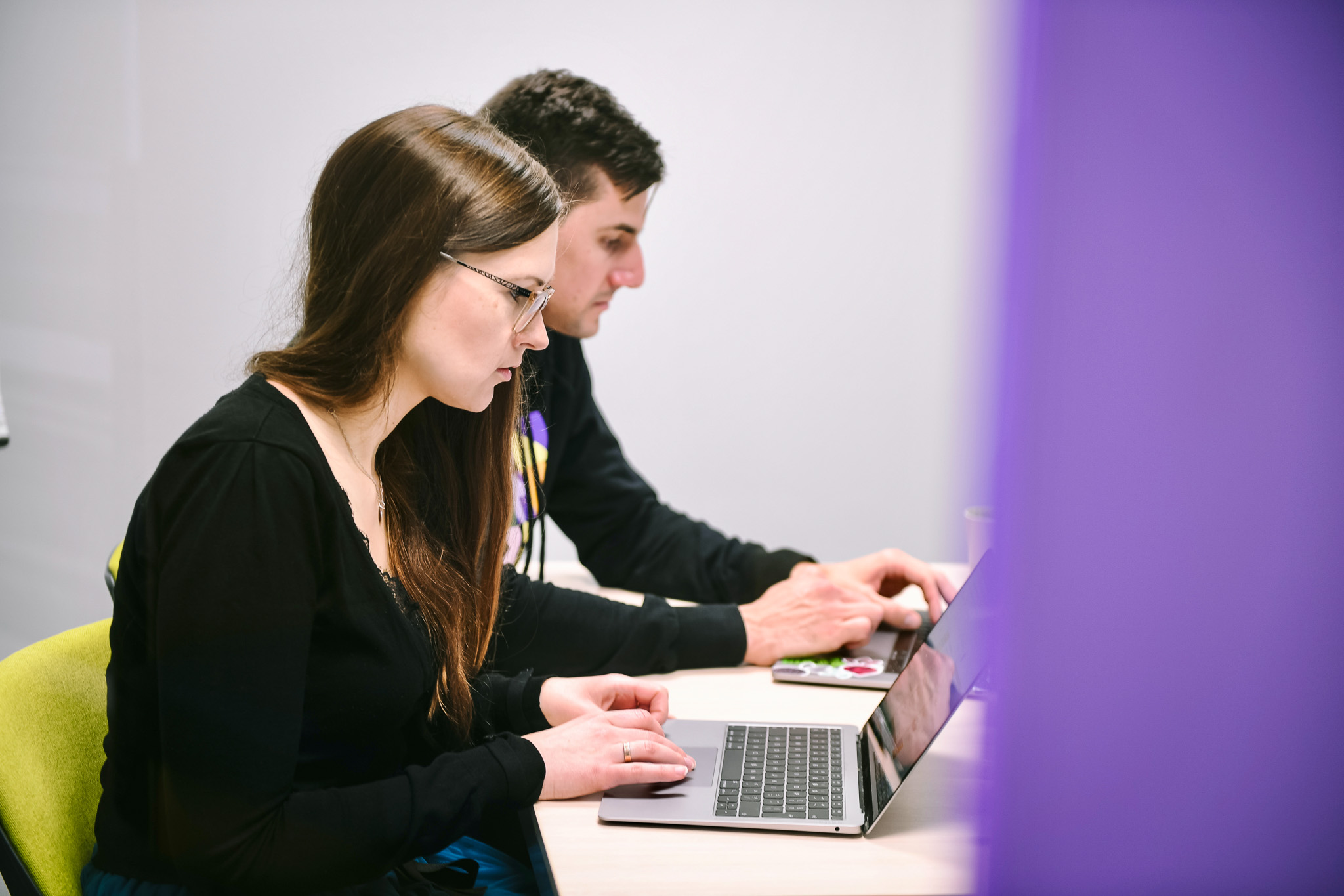 Two people on their computers